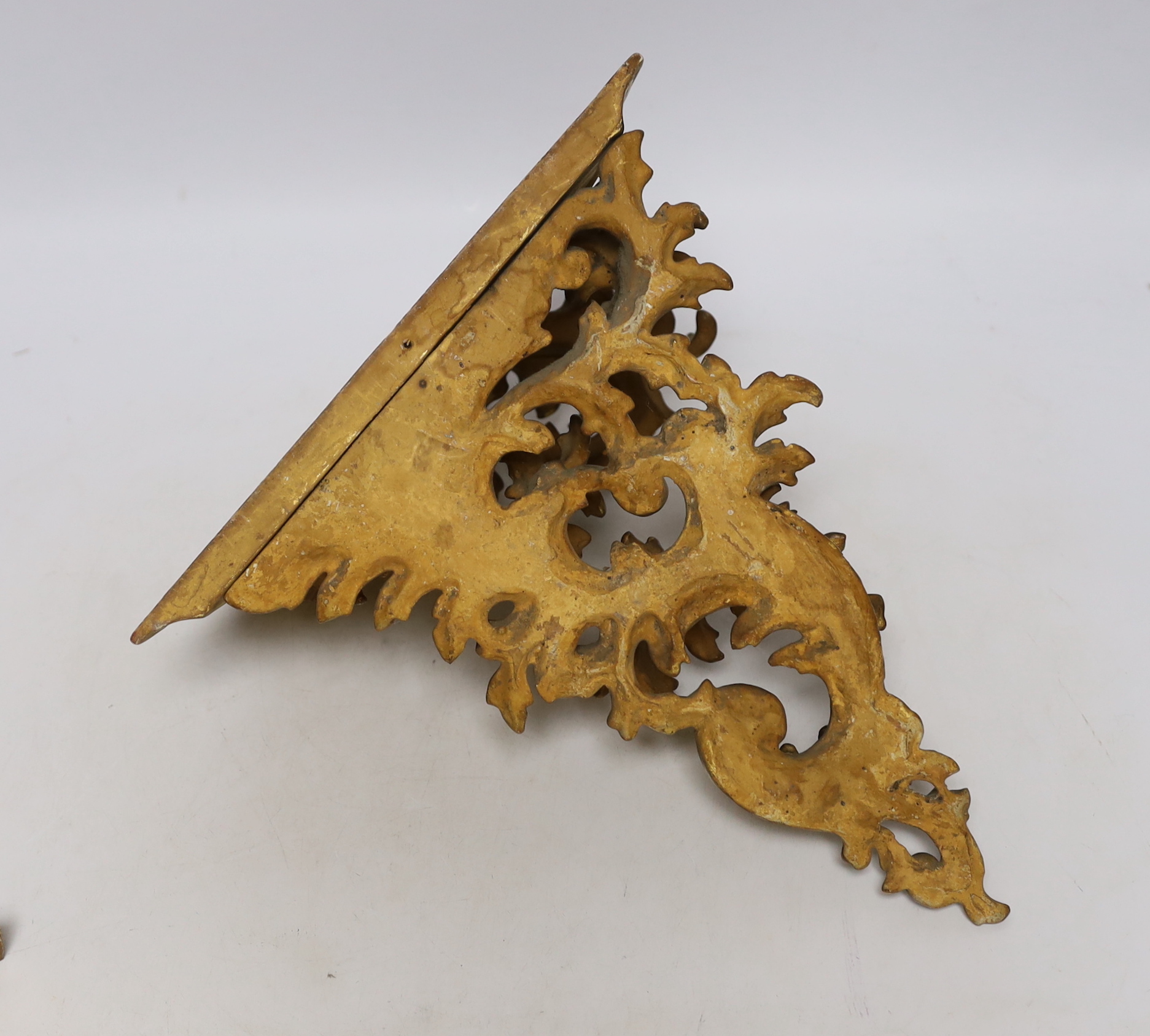 Two late 19th century Florentine rococo style giltwood wall brackets, largest 27cm long